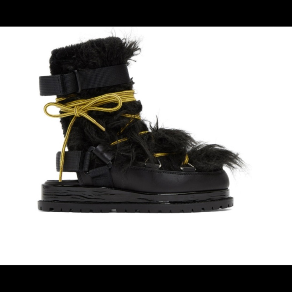 Black open back boots by Sacai